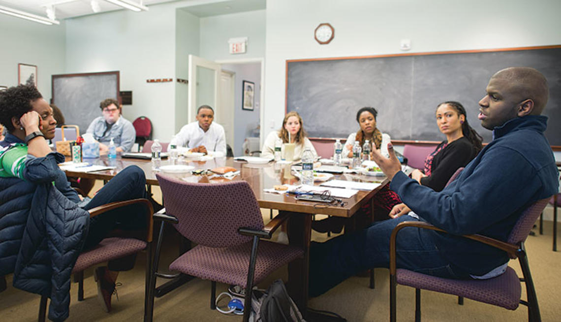 Paul Riley Jr. ’15, far right, discusses his thesis with professors and students at a meeting of the African American studies senior colloquium last spring.