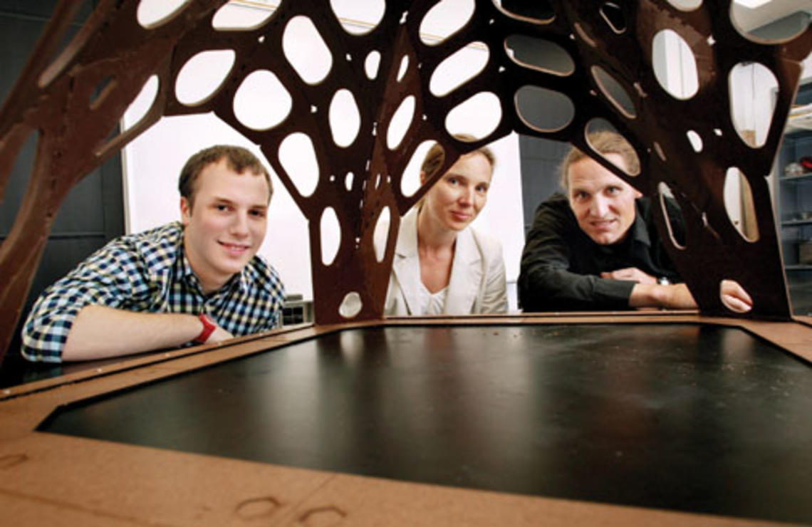 Admiring the chocolate pavilion created by Alex Jordan *13, left, are assistant professors Sigrid Adriaenssens and Axel Kilian.