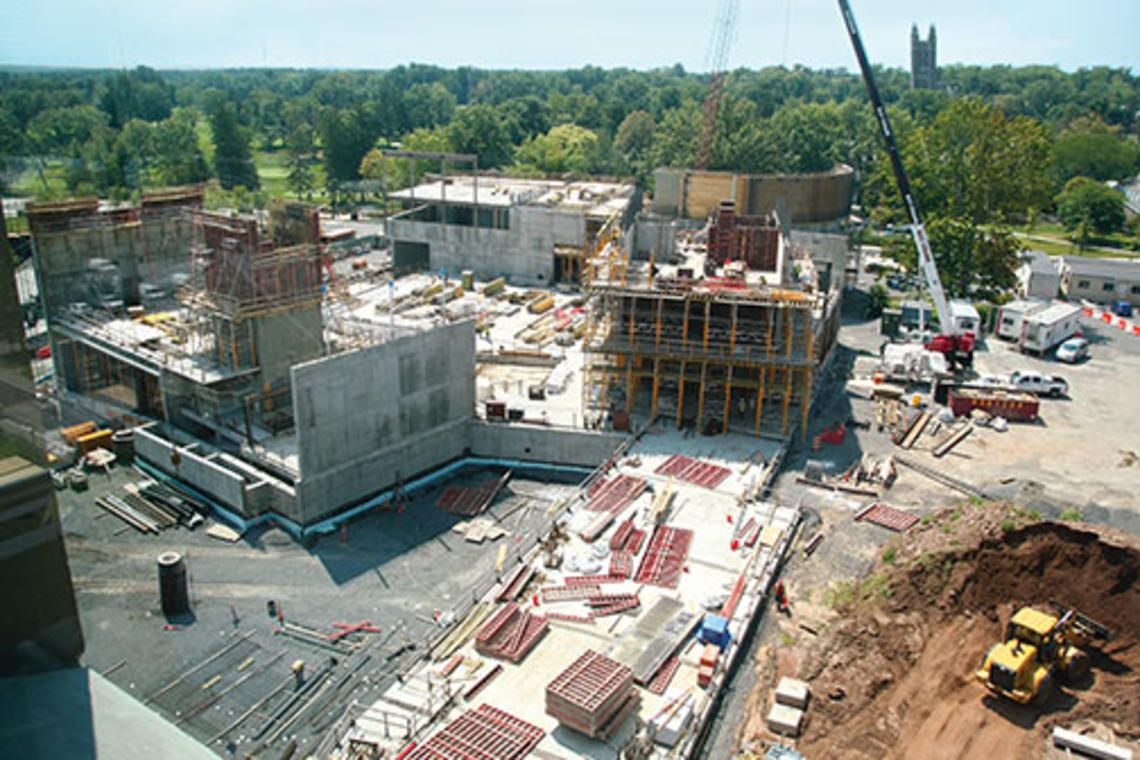 Concrete and steel have been rising for the three buildings on Alexander Street that will provide academic, rehearsal, and performance spaces for the music department, at left, and for the Lewis Center for the Arts.