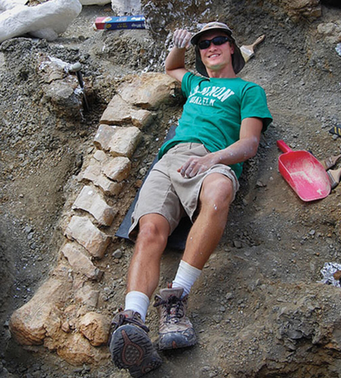 Evan Saitta ’14 at the site of a fossil dig in Montana.
