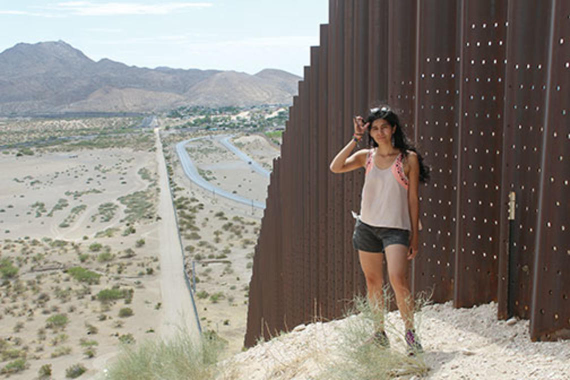 Yessica Martinez ’15 along the U.S.-Mexico border last summer on a research trip for her thesis.