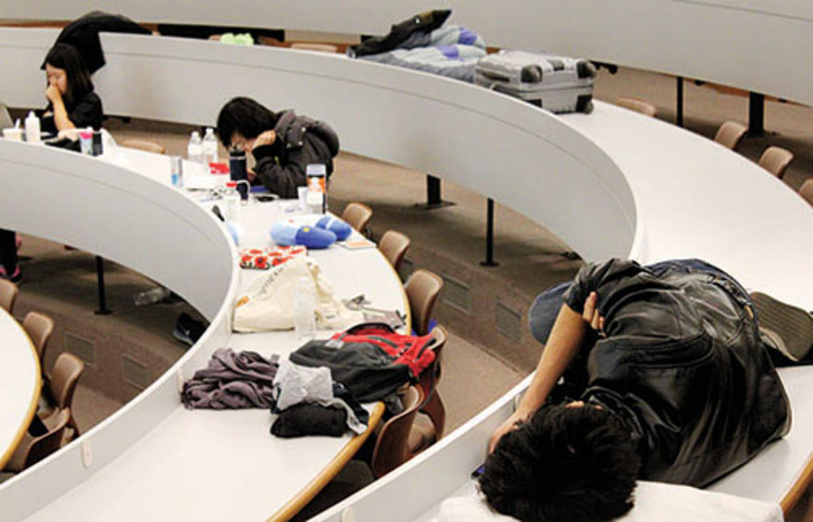 The “mental marathon” of HackPrinceton takes its toll Saturday night on students in a Friend Center lecture hall.