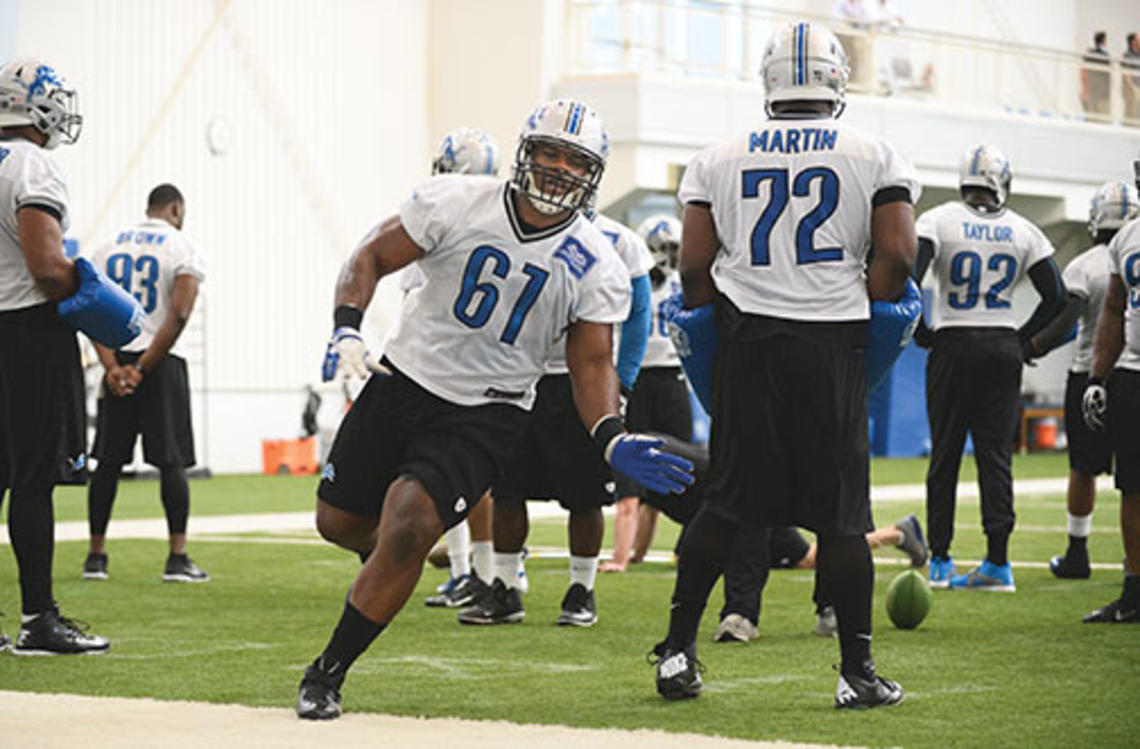 Caraun Reid ’14 (61) runs a drill with the Detroit Lions.