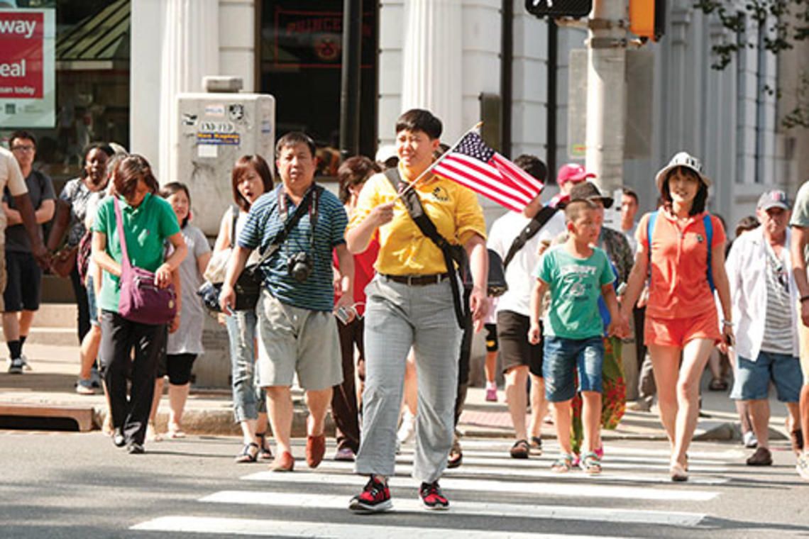 Frank Wojciechowski - A University-bound tour group crosses Nassau Street.