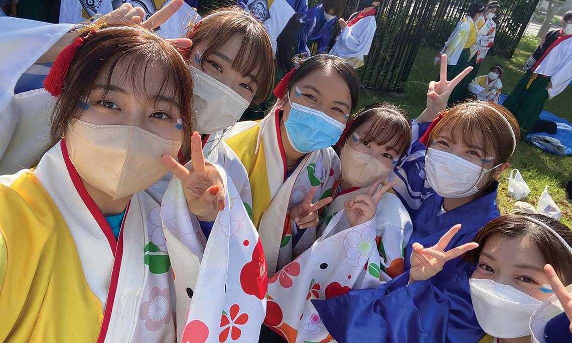 Anne Wen ’23, at center in blue mask, attends a traditional Japanese festival in Osaka, Japan