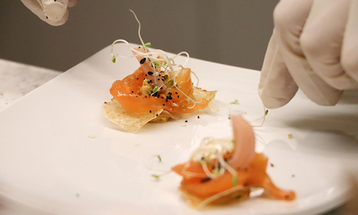 This is a close-up photo of cured salmon atop “invisible” chips.