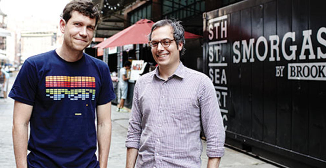   Jonathan Butler ’92, left, and his business partner Eric Demby at the Brooklyn Flea’s SmorgasBar at South Street Seaport in Manhattan.