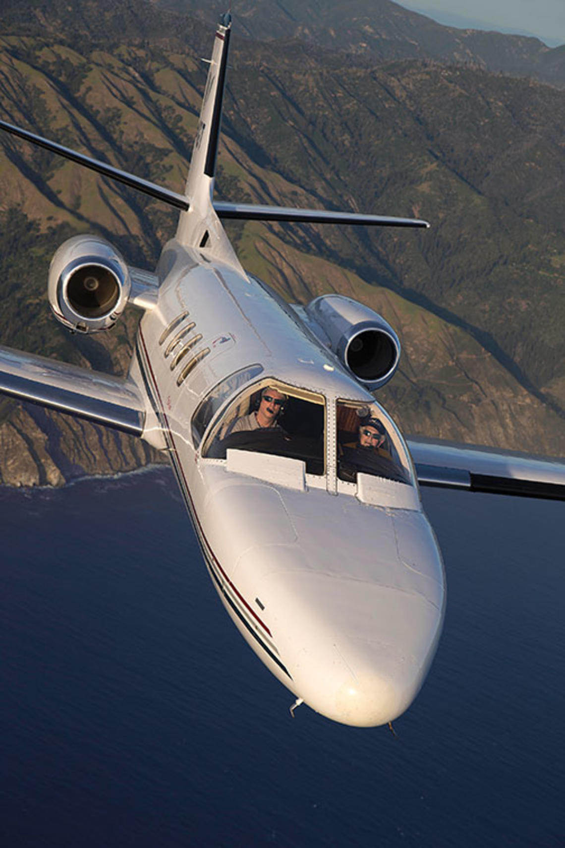 Howard Tobin ’60 at the controls of his Citation Jet, which he uses to transport wounded veterans.