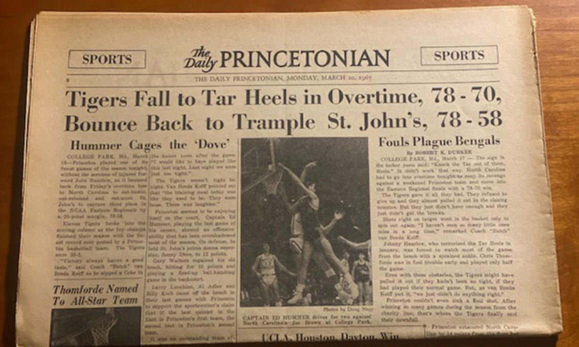 A yellowed copy of The Daily Princetonian on March 20, 1967, with a banner headline reading, "Tigers Fall to Tar Heels in Overtime, 78-70, Bounce Back to Trample St. John’s, 78-58."