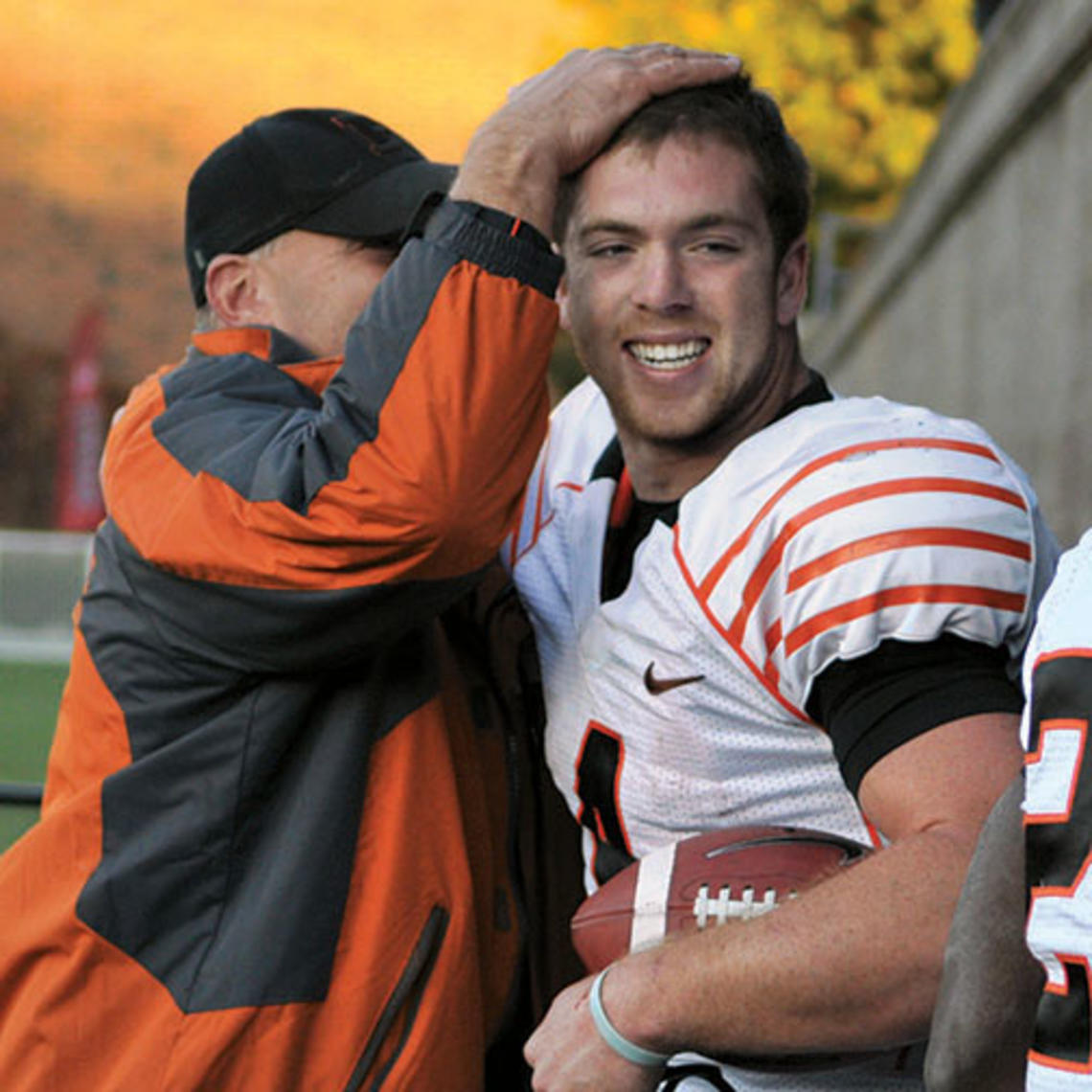 Quarterback Quinn Epperly ’15 is congratulated after his sixth touchdown pass of the day beat Harvard, 51–48.