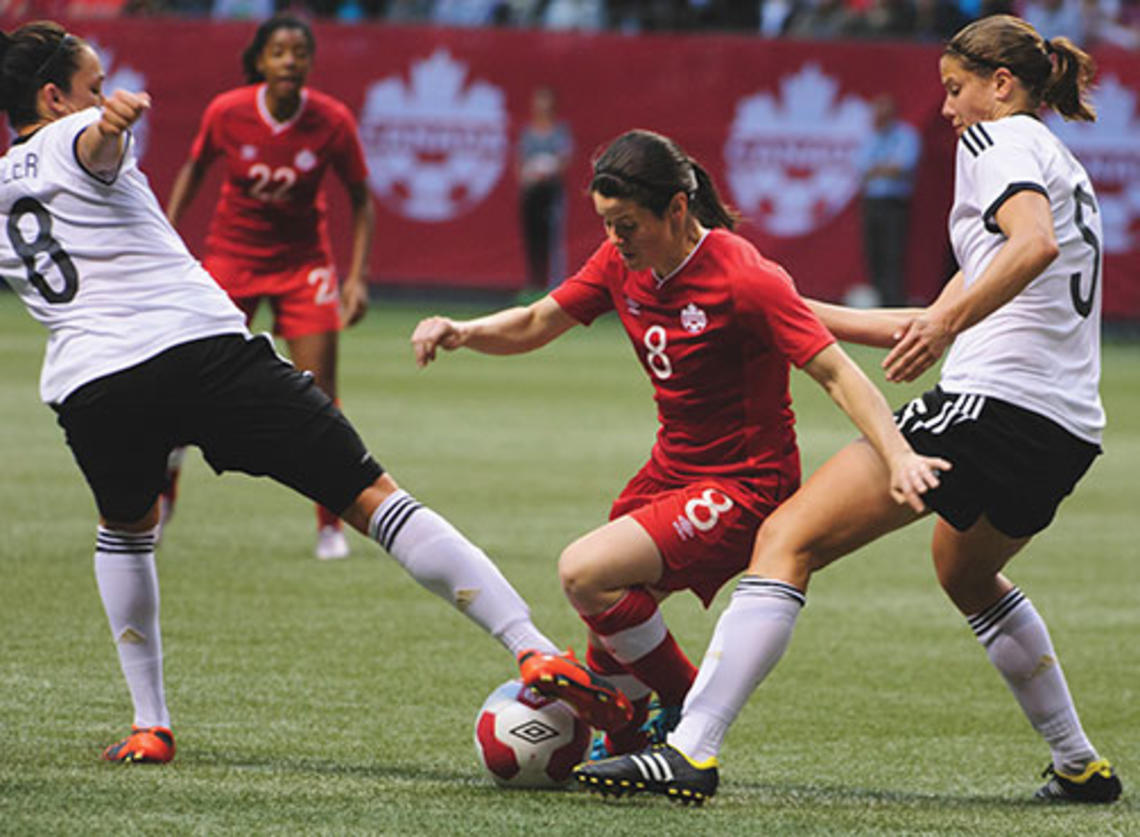 Diana Matheson ’08, center, was named to Canada’s World Cup roster in April.