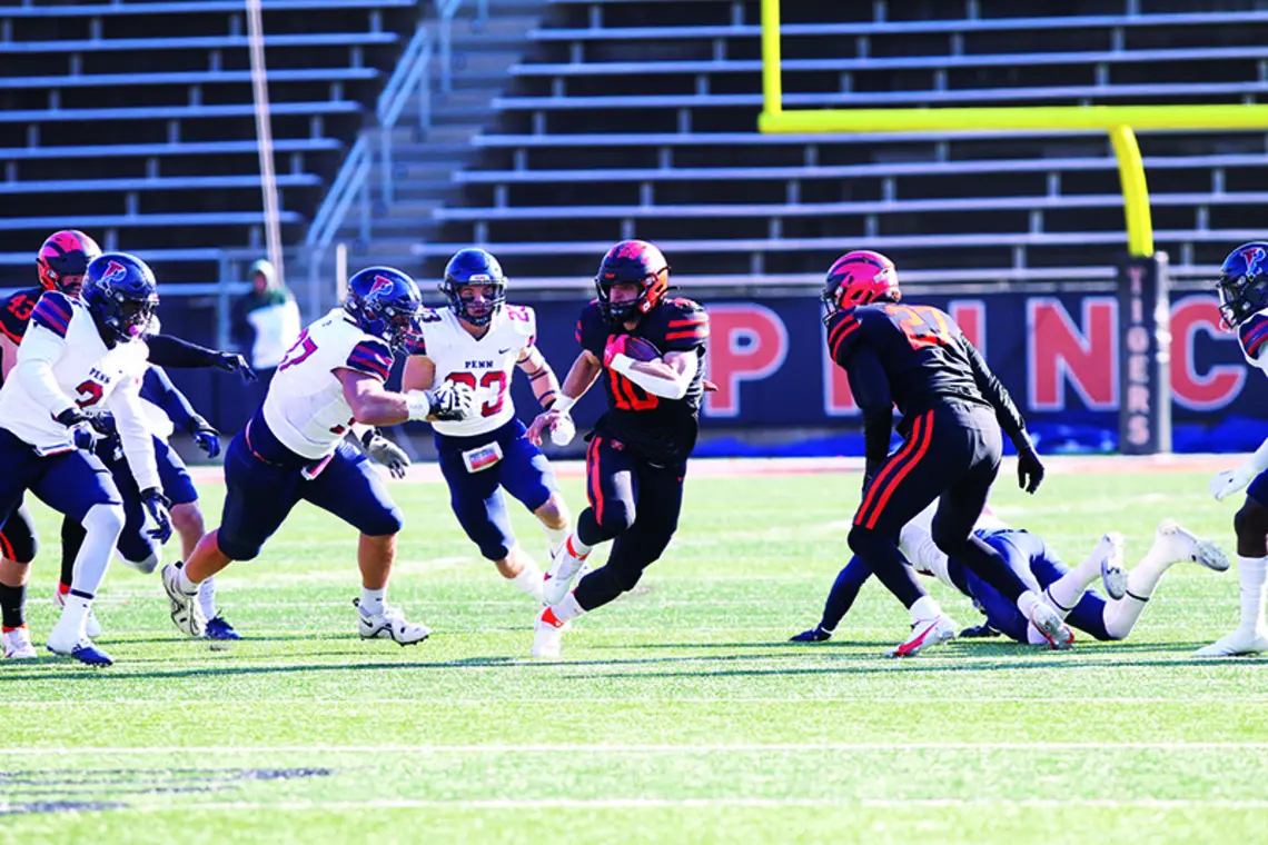 SPORTS_PU vs Penn 014.jpg Niko Vangarelli ’25 runs for a first down.