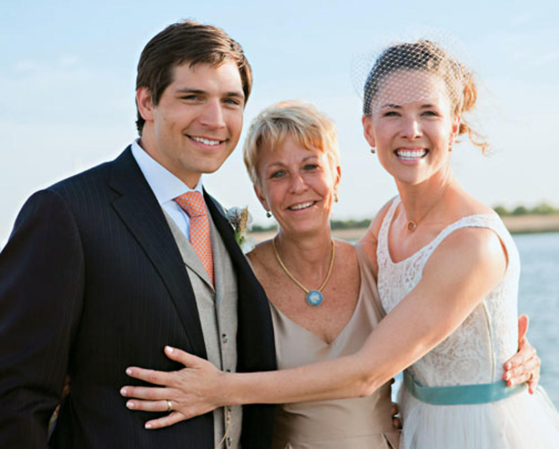 Swimming coach Susan Teeter, center, officiated at the May wedding of Alyson Goodner ’00 and Paul Daniels.