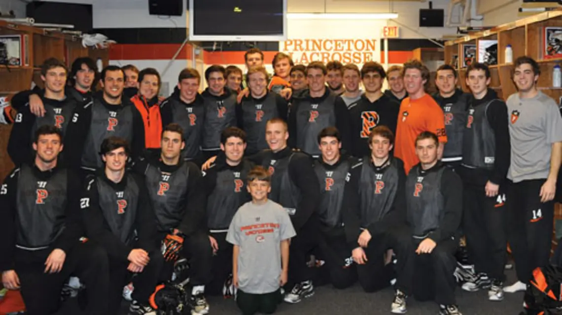 The lacrosse team with coach Chris Bates’ son, Nicholas, whose mother died of cancer last year.