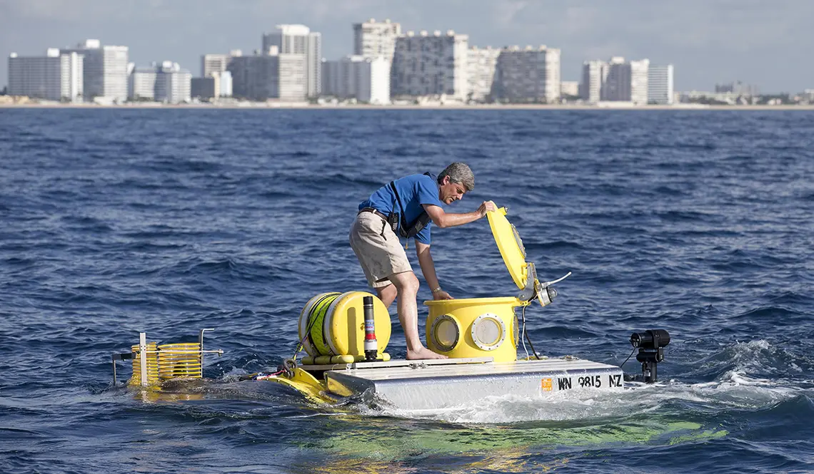 StocktonRush1.jpg In this photo from June 2013, Stockton Rush ’84 opens the hatch on submersible “Antipodes,” which OceanGate used to offer scientists and wildlife officials a close-up look at the invasive lionfish deep in the waters off South Florida.