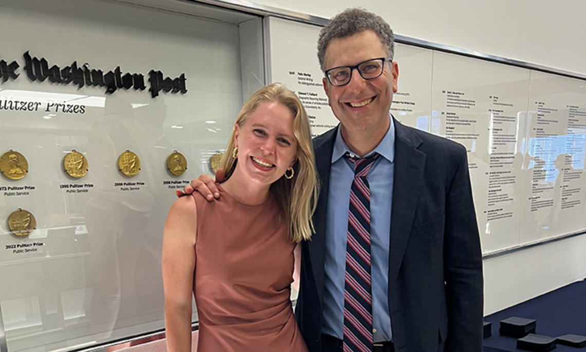 TOW_CarolineKitchener.jpg Caroline Kitchener ’14 and her editor, Peter Wallsten, next to a display of Pulitzer Prizes won by The Washington Post.