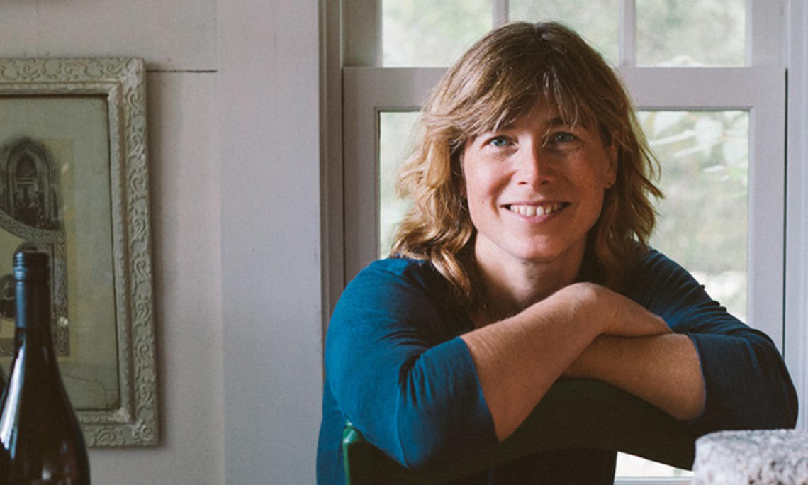 This is a photo of Madeleine Vedel ’89 in front of a window.