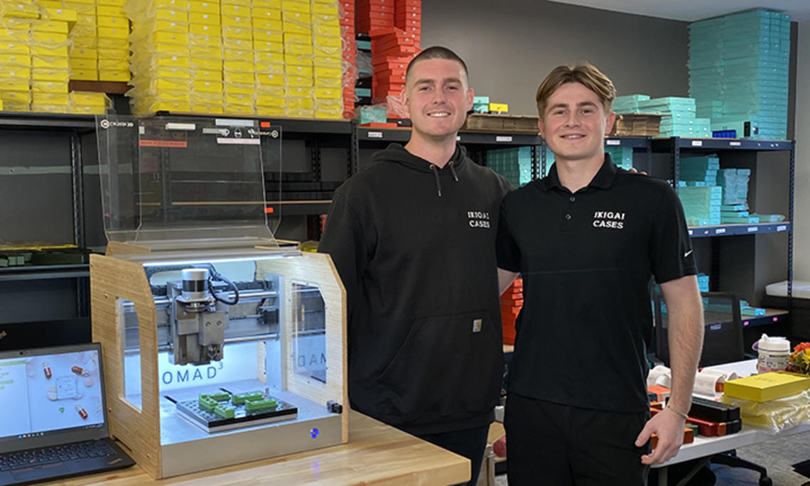 Tavish Rice ’20, left, and his brother Breton at work in a lab.