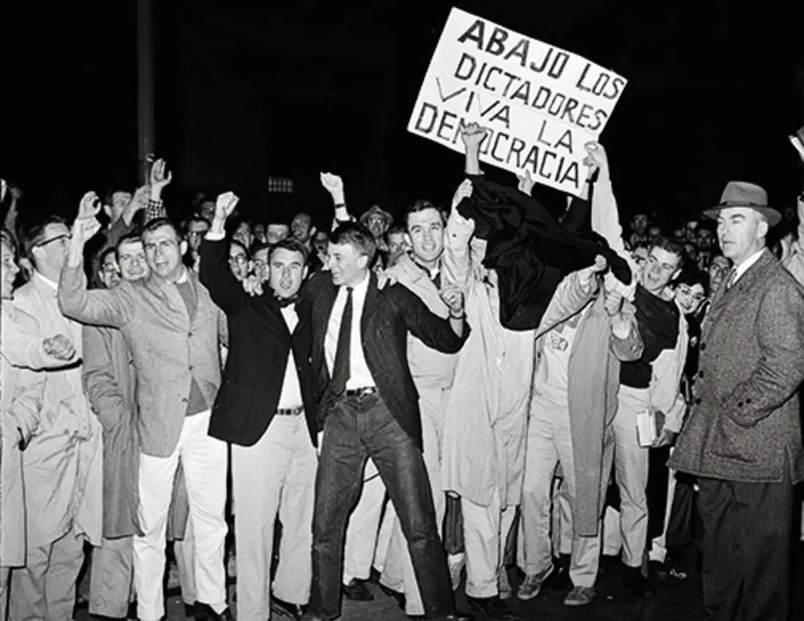 A crowd greeted Fidel Castro at the Princeton Junction train station. Below, after speaking at a conference on campus, Castro stopped to talk with students and others on Washington Road.
