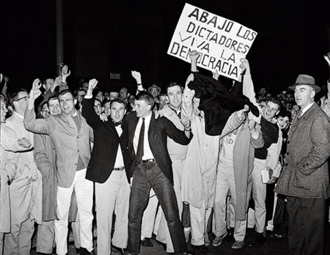 A crowd greeted Fidel Castro at the Princeton Junction train station. Below, after speaking at a conference on campus, Castro stopped to talk with students and others on Washington Road.