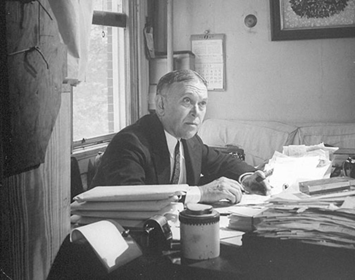 H.L. Mencken writes at his desk in Baltimore in the mid-1940s.