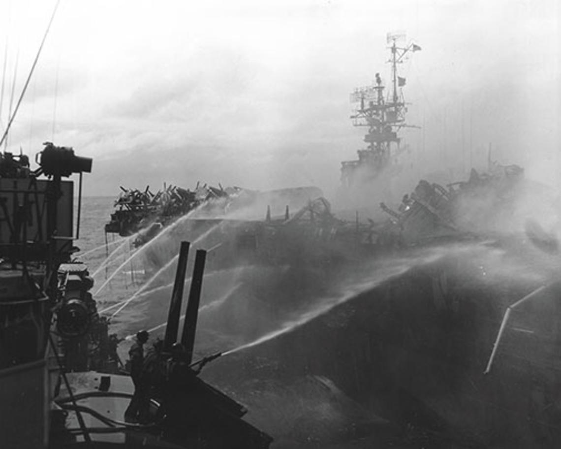 Alan Reed ’40 died after boarding the USS Princeton, in flames, Oct. 24, 1944. He was assigned to the USS Birmingham, shown here fighting the fire.