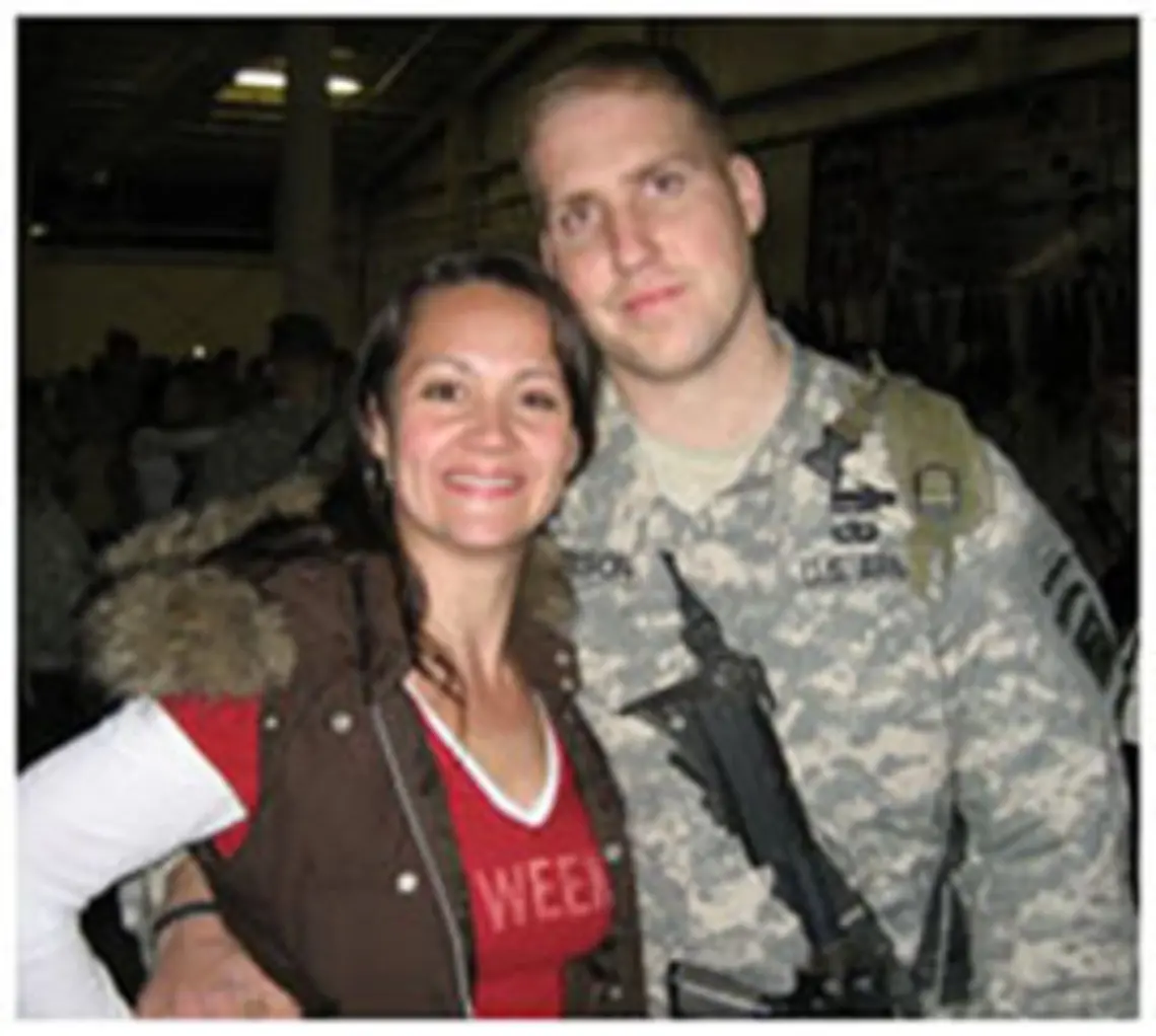 as061108Nelson.jpg Lauren (Holuba) Nelson '04, shown with her husband Tom in February, was honored for her efforts supporting wives and families of men who served in Afghanistan and Iraq.