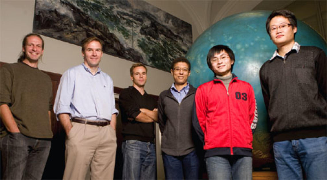 Newly appointed geosciences professor Jeroen Tromp *92, second from left, meets with members of his research group in Guyot Hall.