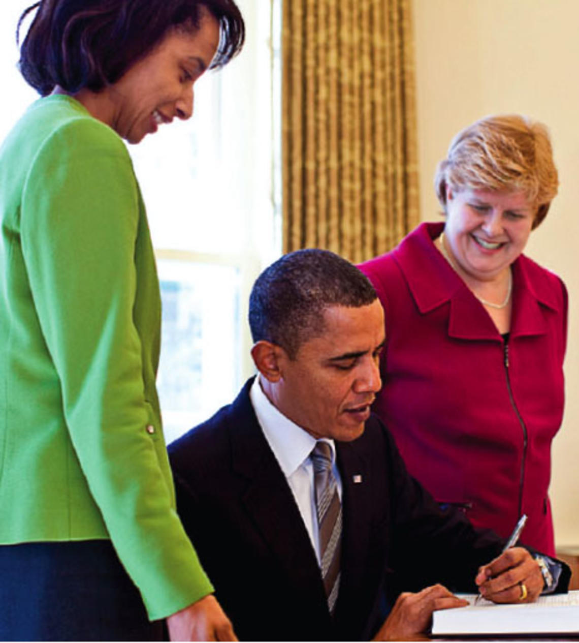 Wells Professor of Economics and Public Affairs Cecilia Rouse (left) and former Princeton faculty member Christina Romer join President Obama in the Oval Office in their roles as members of his Council of Economic Advisers.