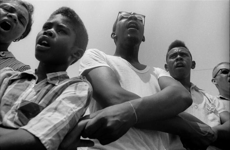 Freedom School, Mileston. Mississippi Summer Project, 1964:  Summer volunteers, SNCC workers and local students singing freedom songs at Mileston, a community of independent black farmers in the Mississippi Delta near Lexington.