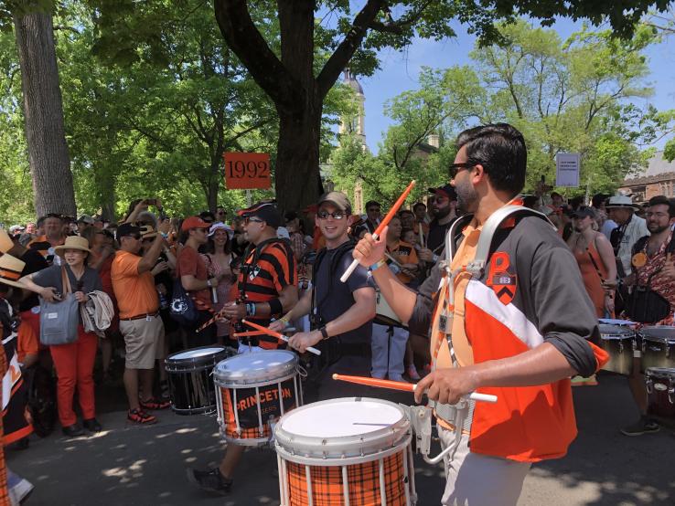 Alumni play drums just before the P-rade starts.