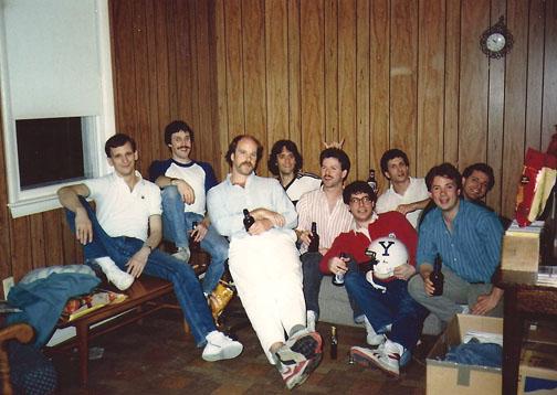 Graduate students celebrate Joe Pont *88’s successful dissertation defense. (The football helmet was a relic from undergraduate days.) From left: Mike Smith *89, John Donovan *89, Jim Farmer *93, Mike Ruggio *90, Pont, Eric Spina *88, Dave Handelman *89