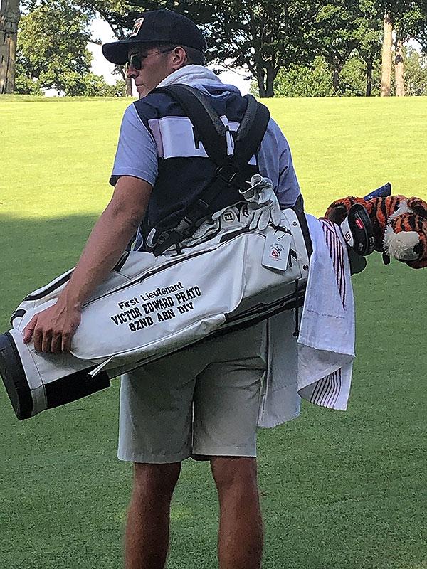 Fretty’s caddie, teammate Henry Dubiel ’24, carried a Princeton golf bag that reads, "First Lieutenant Victor Edward Prato 82nd ABN DIV." A plush tiger covers one of the golf clubs.