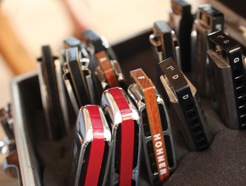Harmonicas are tuned to different keys, so musicians travel with several of them.