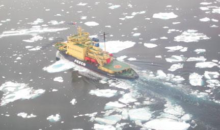The ship breaking ice, as seen from a helicopter.