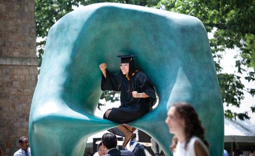  Shelley Chan ’11 ­celebrates from her perch on Henry Moore’s “Oval with Points.”