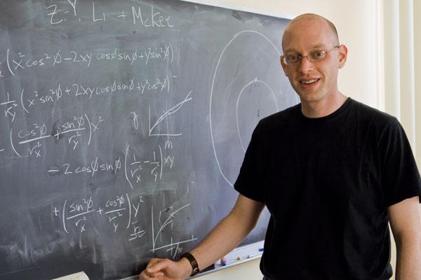 Postdoc researcher Mark Krumholz '98, shown in his office, started Princeton Project Inside.