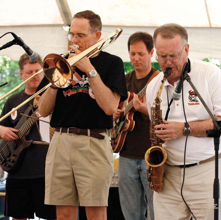  John Beers '76, trombone, and Clint Padgitt '68, alto sax, provide entertainment on the south lawn of the Frist Campus Center at the first Battle of the Alumni Bands.