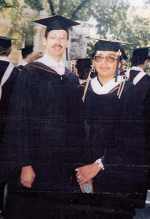 Jim, right, with classmate Marcos Rodriguez at Commencement in ­1986.