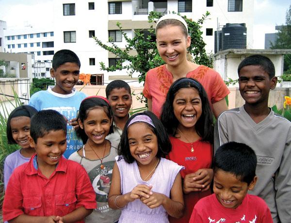 Julia Neubauer ’07 with children who live at the home for street children she and other students started in Pune, India.