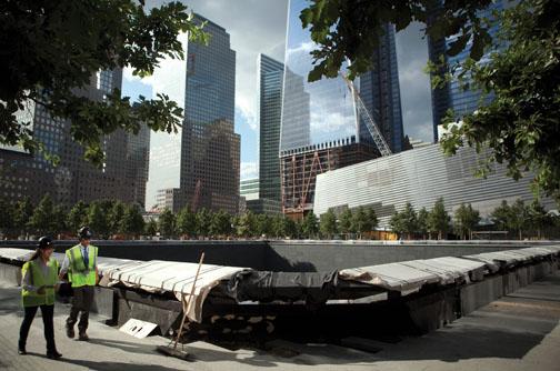 Weisser walks by what will be a reflecting pool inscribed with the names of 9/11 victims.