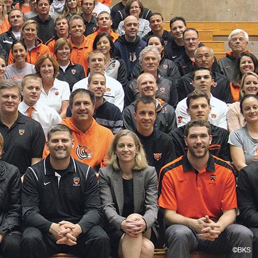 Mollie Marcoux ’91, front row center, poses with coaches and athletics department staffers.