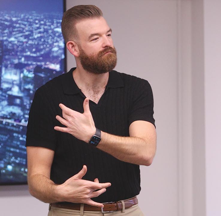 Noah Buchholz teaching American Sign Language literature.