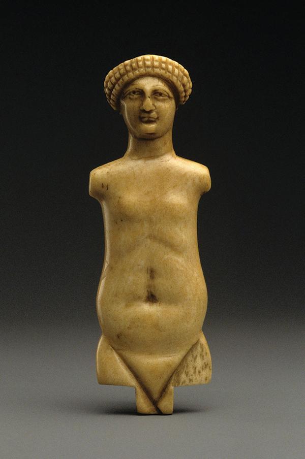 A small yellow sculpture of a woman.