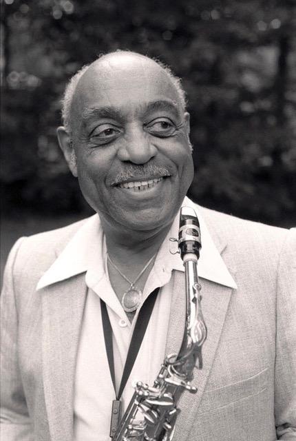 This is a black and white headshot photo of Benny Carter.