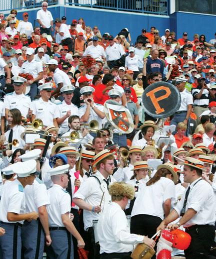 After booing the Princeton band’s halftime show, Citadel cadets surround the band in the stands.