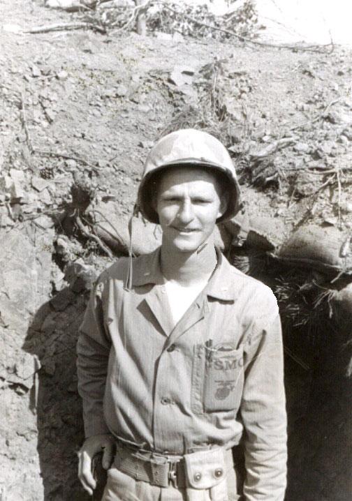 Peter Clapper ’49 in front of his "hole" in Korea. Clapper led a Marine infantry platoon and later suffered from post-traumatic stress disorder.