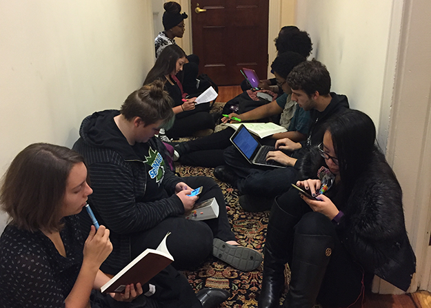 On Wednesday afternoon, the sit-in spilled into the hallway outside President Eisgruber â83âs office. (Mary Hui â17)