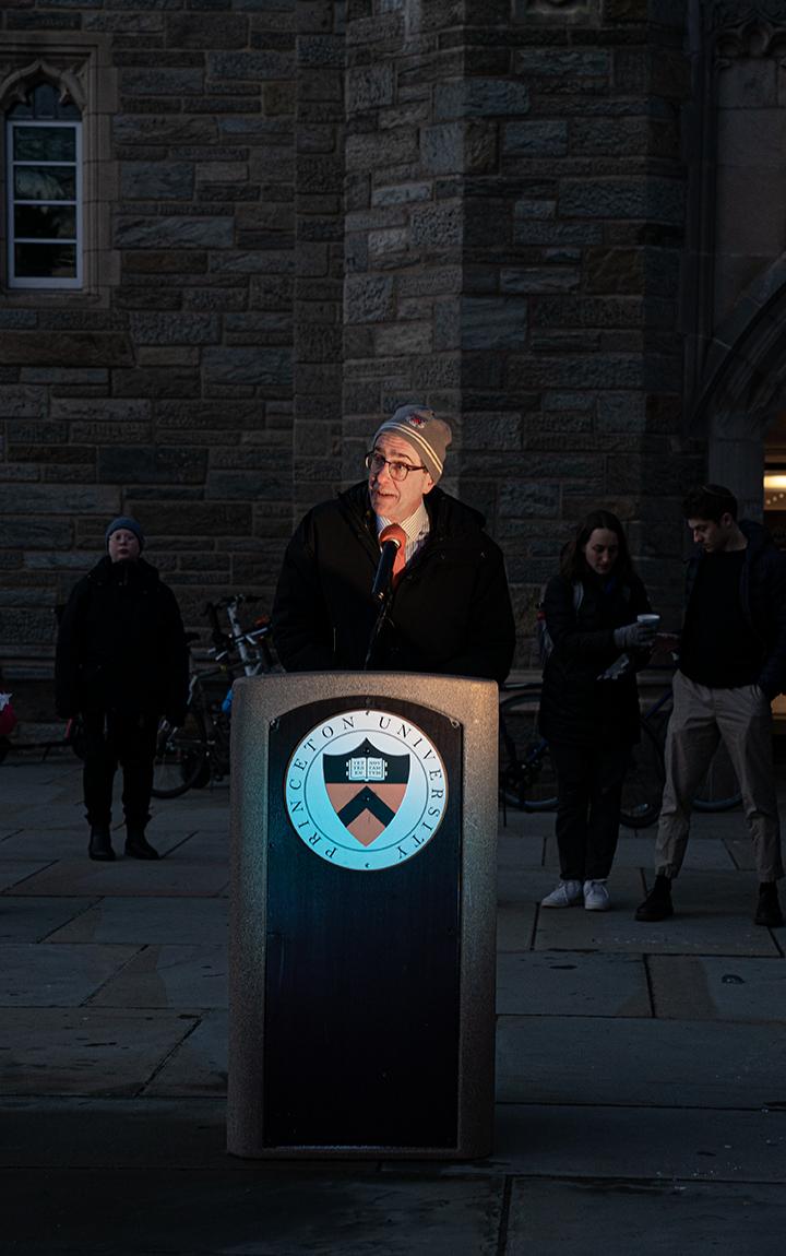 President Christopher Eisgruber speaks at a podium with Princeton's seal on it.