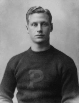 Black and white photo of Hobey Baker in his Princeton sweater. 